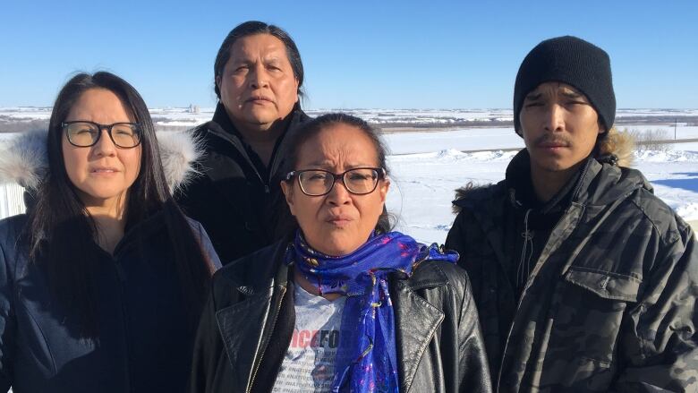 Colten Boushie's mother Debbie Baptiste (center), brother William Boushie (right), uncle Alvin Baptiste (back) gathered at the law office of friend Eleanore Sunchild (left).