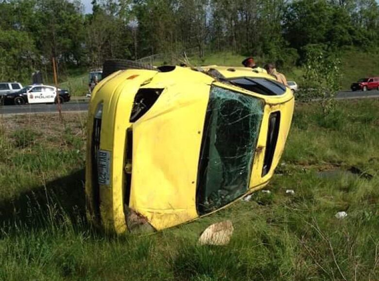 rolled over car in ditch