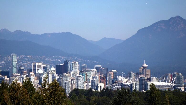 The Downtown Vancouver skyline with the B.C. Place Stadium and the Harbour Centre visible.