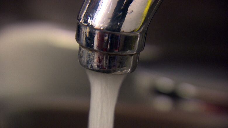 Water coming out from a tap.