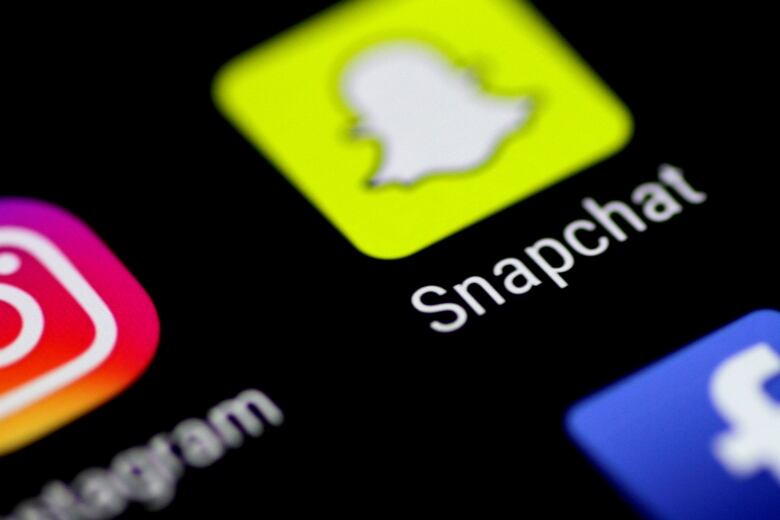 A phone screen shows icons for Snapchat, Instagram and other apps. 