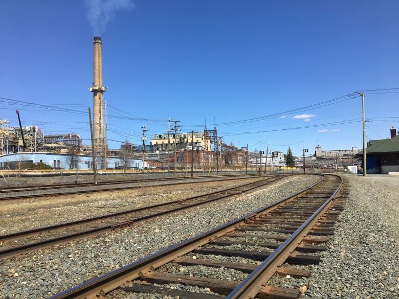 A railroad pictured next to a copper smelter