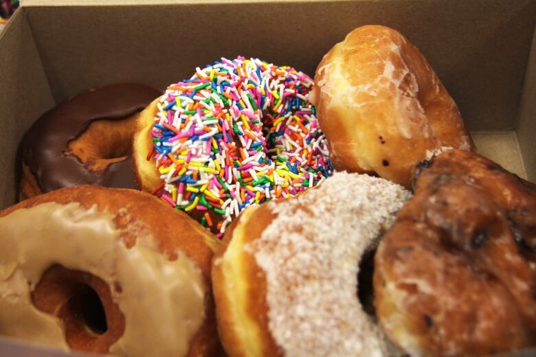 A plate full of donuts.