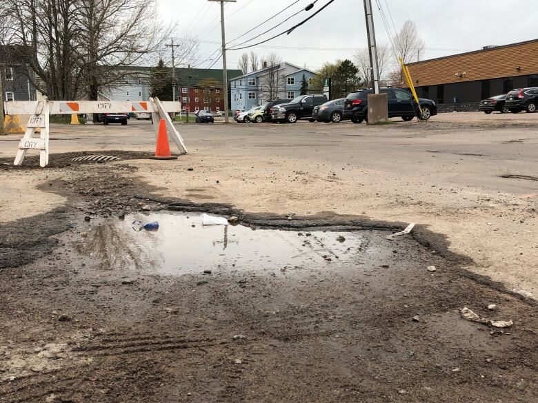 A pothole on a road in downtown Charlottetown filled with water.