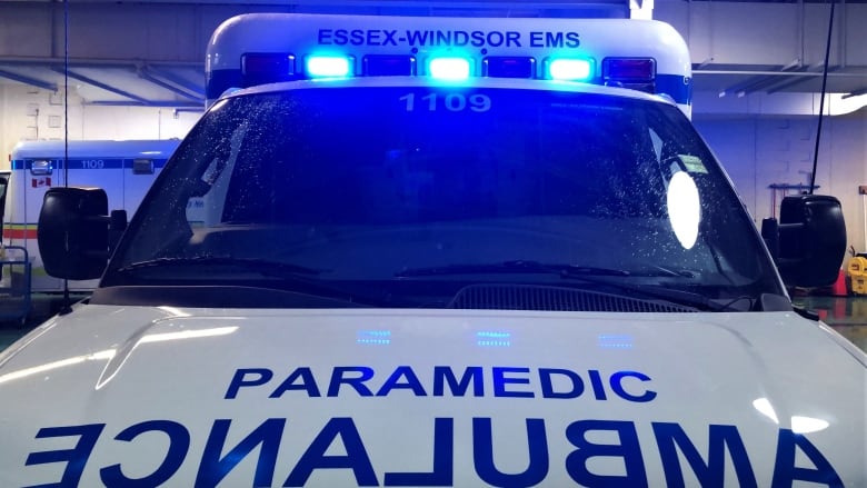 An ambulance with lights flashing. 