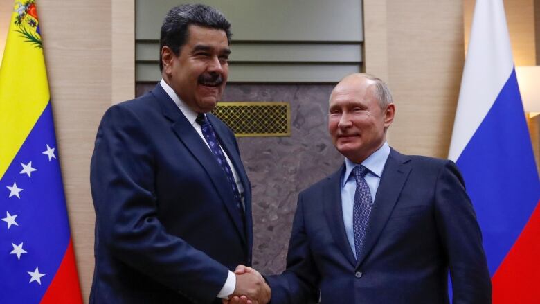 Russian President Vladimir Putin, right, shakes hands with his Venezuelan counterpart Nicolas Maduro on Dec. 5, 2018 in Moscow. Russia supports the Maduro government through oil imports and by providing military expertise. 