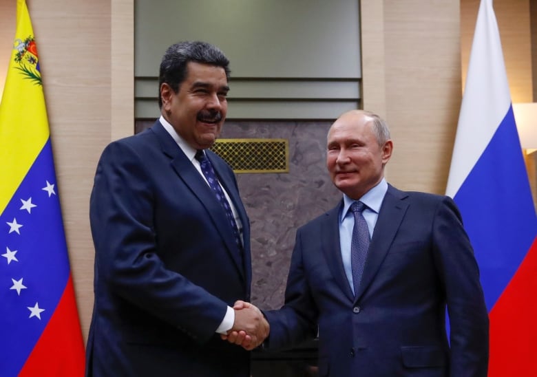 Russian President Vladimir Putin, right, shakes hands with his Venezuelan counterpart Nicolas Maduro on Dec. 5, 2018 in Moscow. Russia supports the Maduro government through oil imports and by providing military expertise. 