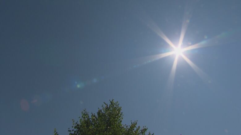 The sun sits high in the sky on a hot day in Ontario.