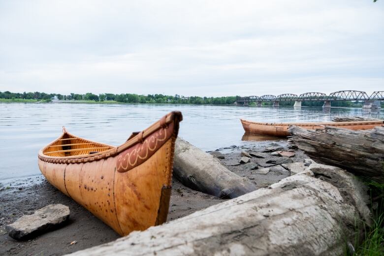 Birch bark canoes next to the Wolastoq river. 