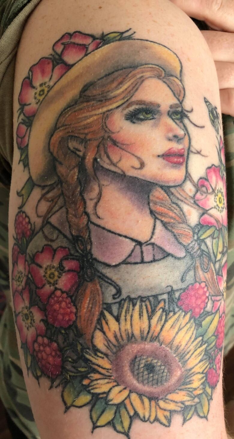 Anne of Green Gables tattoo on arm.