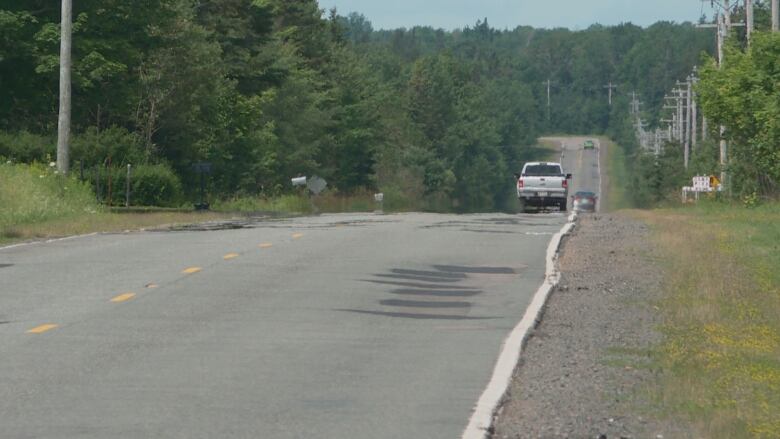 Georgetown Road in eastern P.E.I., with three vehicles visible.