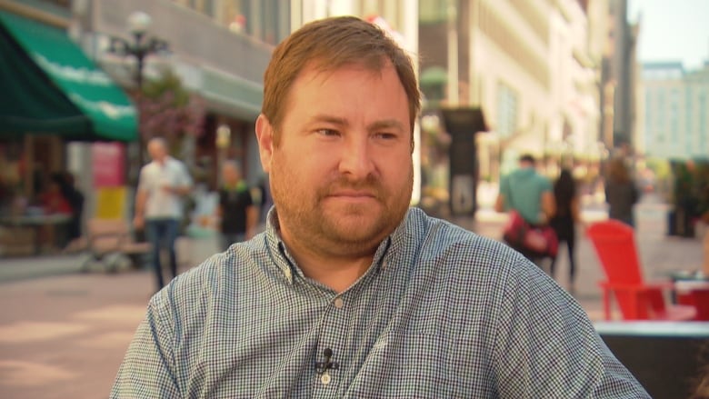 A man sits for an interview in Ottawa.