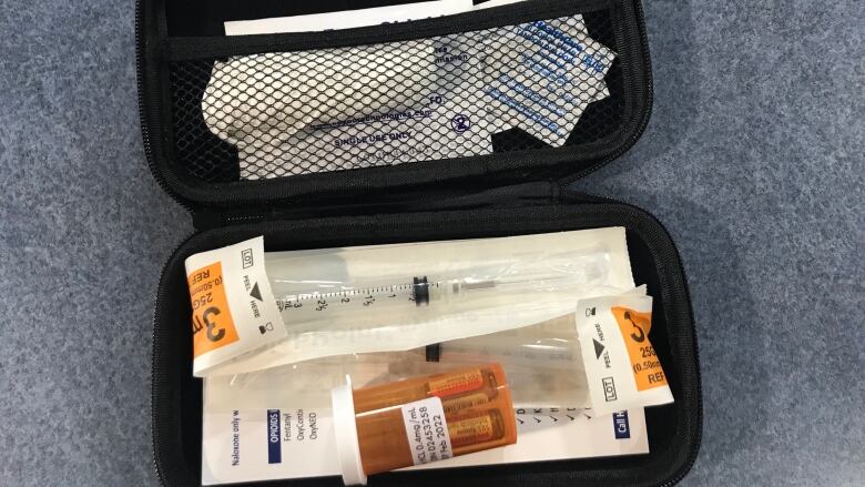 A naloxone kit is pictured.