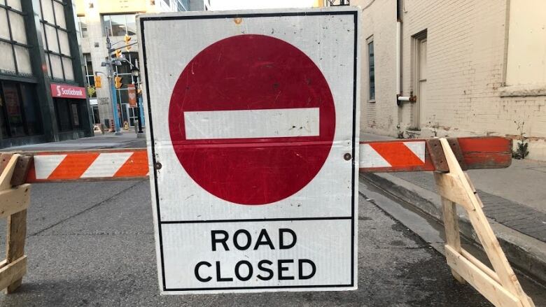 Road closed sign.