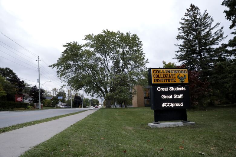 A school sign that reads Collingwood Collegiate Institute. The electronic sign also says, 