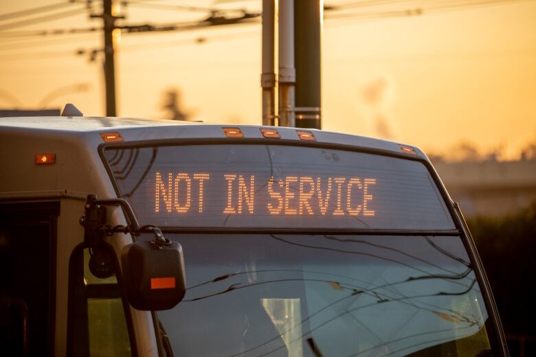 A close-up of the front of a bus with the sign saying 