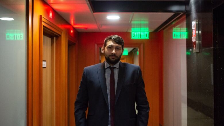 Man standing in hallway