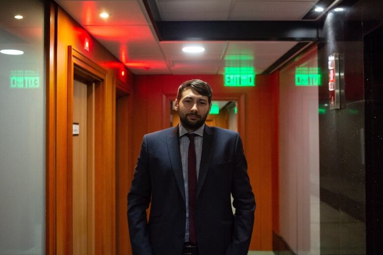 Man standing in hallway