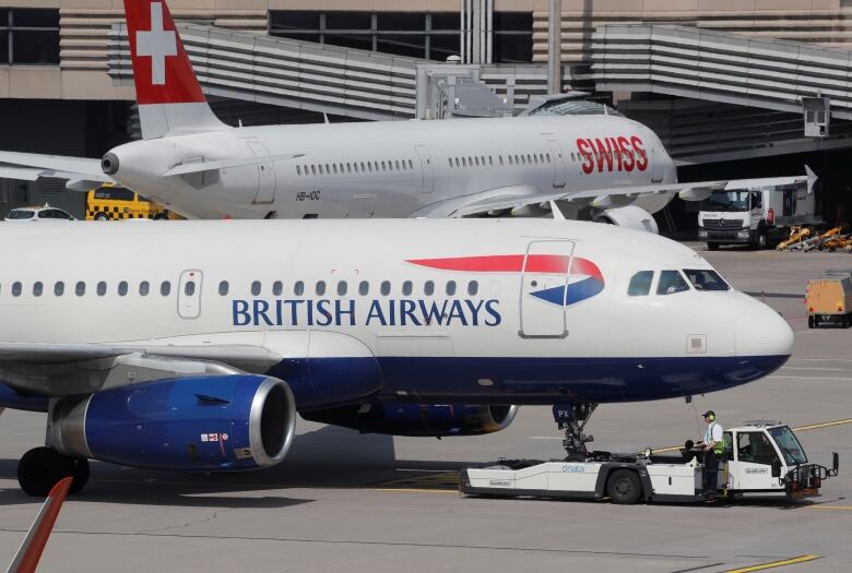 An aircraft of British Airways airlines is pulled by a Goldhofer pushback tractor of air service provider DNATA at Zurich airport, Switzerland April 16, 2019.  Picture taken April, 16, 2019.  