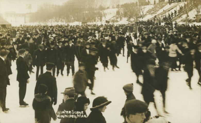 Black and white photo of people skating on a river