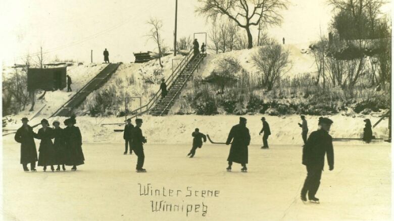 Black and white photo of people skating on a river