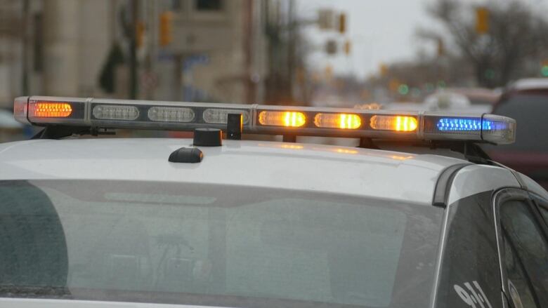 Police lights on top of a cruiser car.