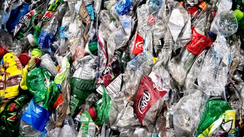 Plastic bottles and containers mashed together.