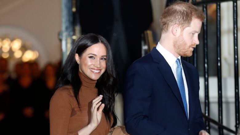 Prince Harry and Meghan Markle are photographed. 