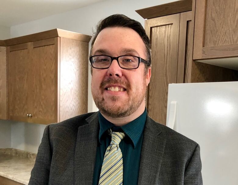 Person standing in a kitchen 