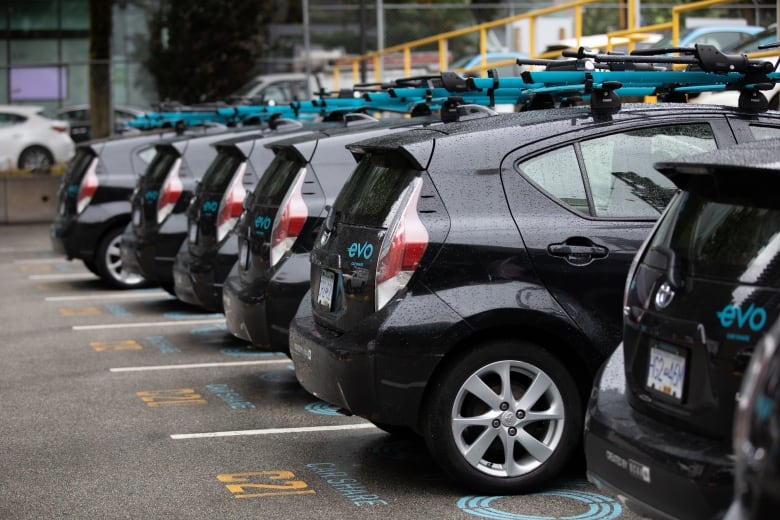 Several Evo-branded vehicles parked in a line.