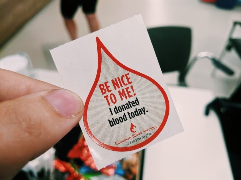 Close up of a sticker that says, 'Be nice to me! I donated blood today.'