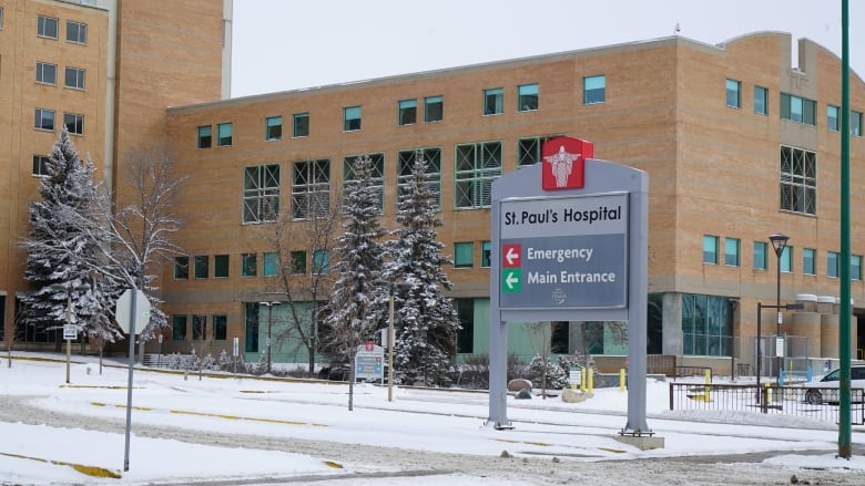 A large brick building, with a sign that says 