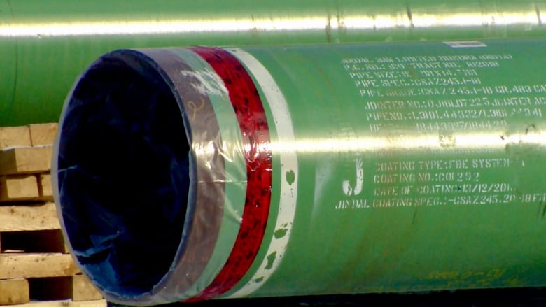 A green pipeline is shown with a plastic cover on the end.