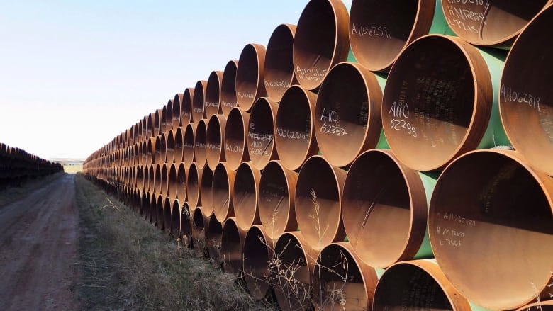 A stack of pipes is pictured.