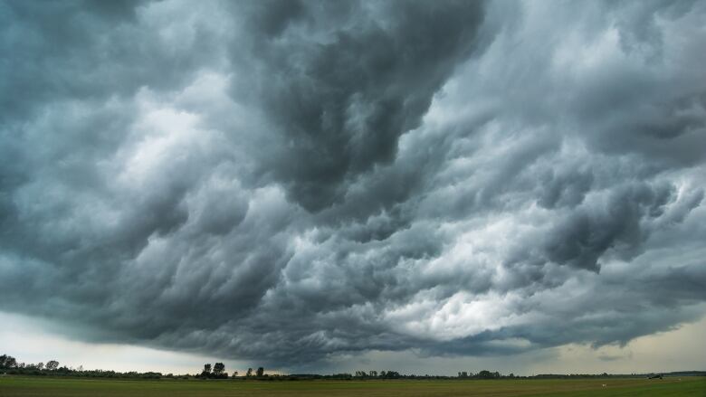 A dark and cloudy sky is shown.