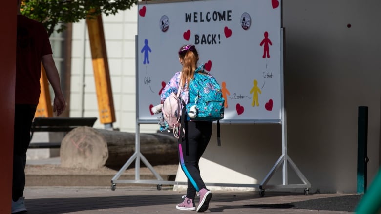 Students are pictured being welcomed back to school with physical distancing protocols in place at Lynn Valley Elementary in North Vancouver, B.C., on June 1. 