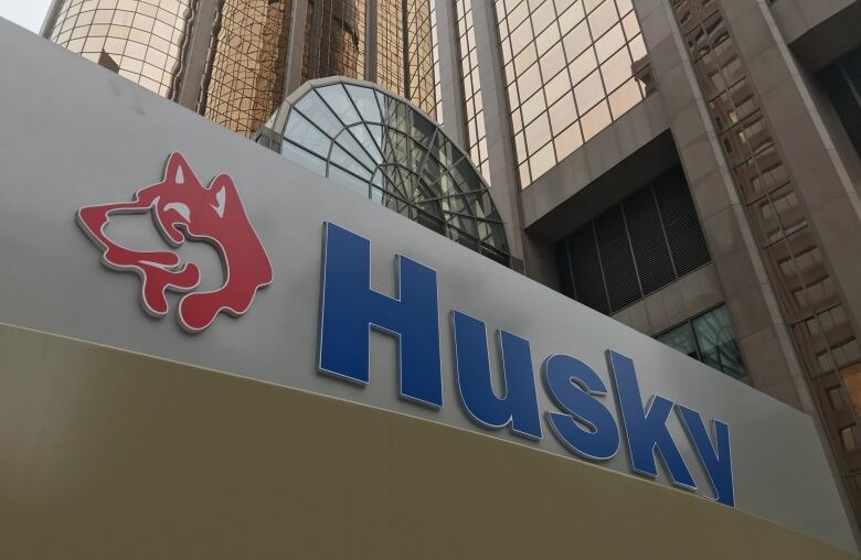 A sign that says husky outside downtown building