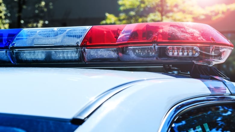 Red and blue flashing lights on police car.