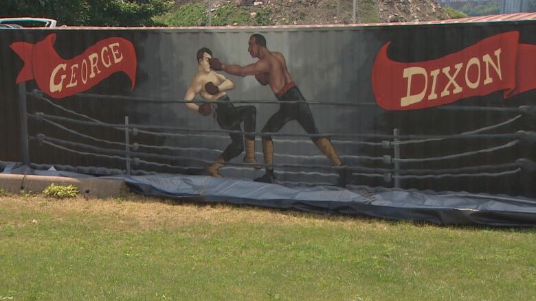 A mural of two boxers fighting in a rings