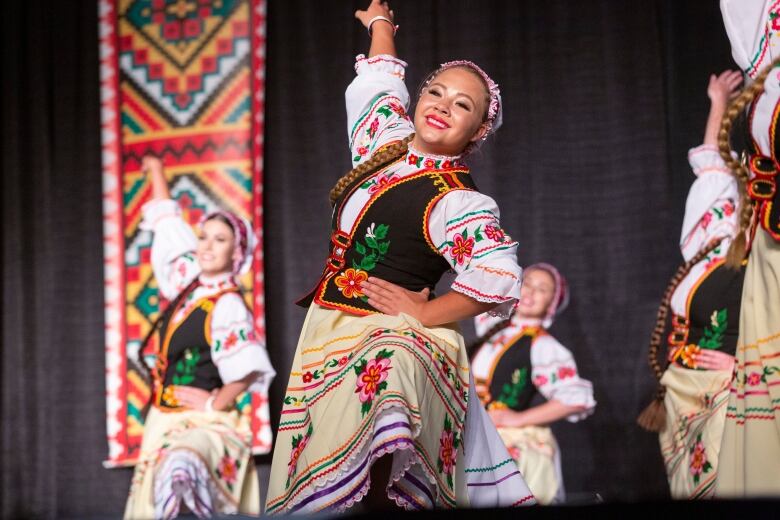 Dancers in colourful outfits. 