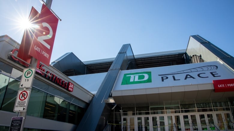 A photo of an entrance to the TD Place stadium and arena in summer.