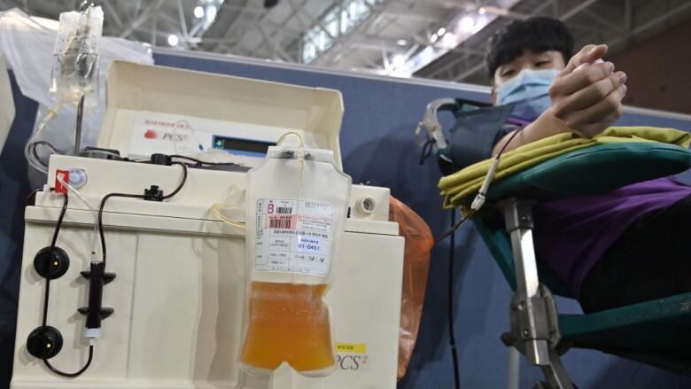 A man donating blood plasma.