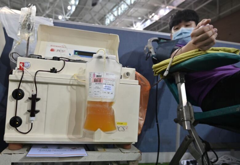 A man donating blood plasma.