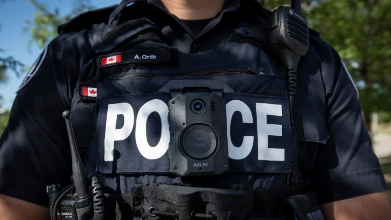 Members of the Toronto Police Service demonstrate new body-worn cameras outside 23 Division. The cameras are made by Axon Enterprise, Inc.