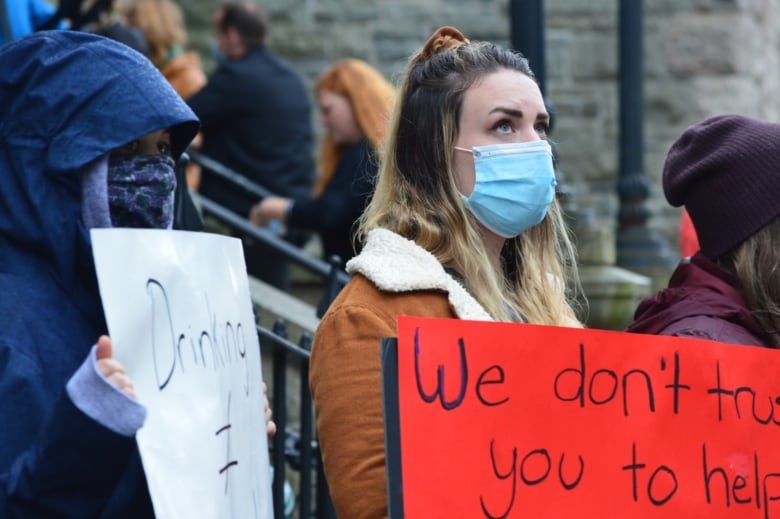 women holding signs