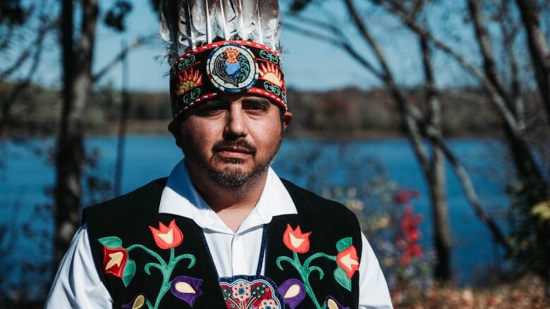 Man wearing Indigenous head dress