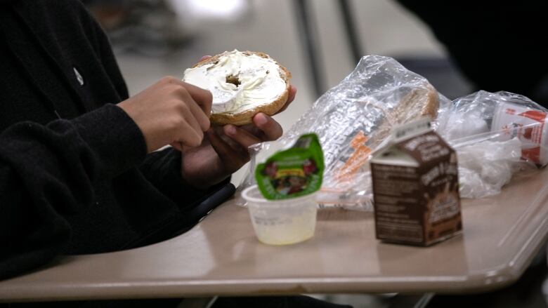 STAMFORD, CONNECTICUT - SEPTEMBER 08: A student prepares lunch in the cafeteria during the first day of school at Stamford High School on September 08, 2020 in Stamford, Connecticut. Due to the coronavirus pandemic, many school districts nationwide delayed the first day of school until after the Labor Day weekend. Stamford Public Schools started the semester with a hybrid model, which includes in-class learning every other day. Many families, however, chose the distance learning option due to fears of COVID-19 transmission between students. (Photo by John Moore/Getty Images)