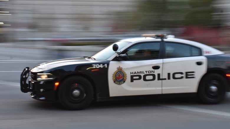 A police car in motion.