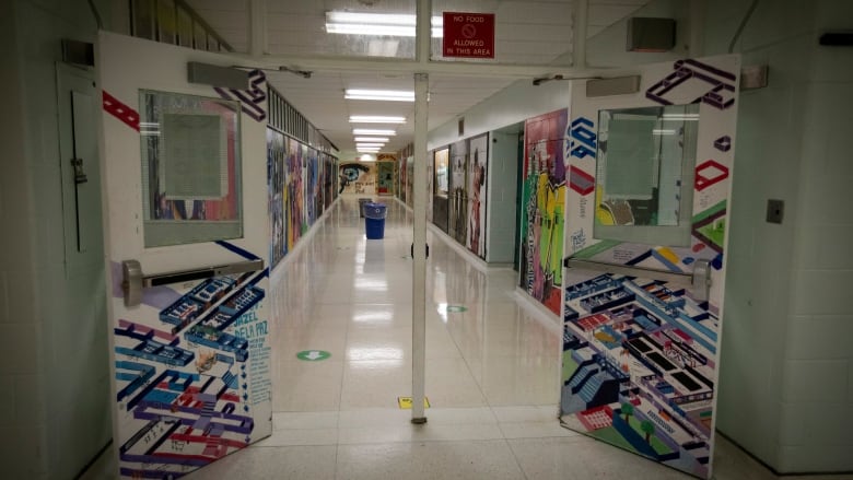 Staff and students at Wexford Collegiate School for Arts, in Toronto, take part in a return-to-school demonstration on Aug. 27, 2020.