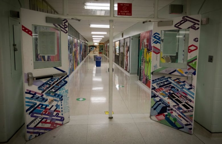 Staff and students at Wexford Collegiate School for Arts, in Toronto, take part in a return-to-school demonstration on Aug. 27, 2020.